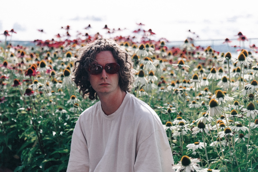 Tim Voilhat with sunglasses in a flower field